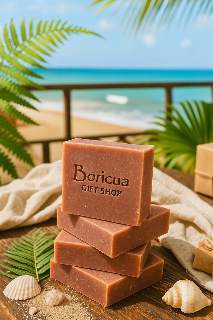 Stack of cranberry vegan soap bars from Boricua Gift Shop on wooden surface with beach and palm leaves background