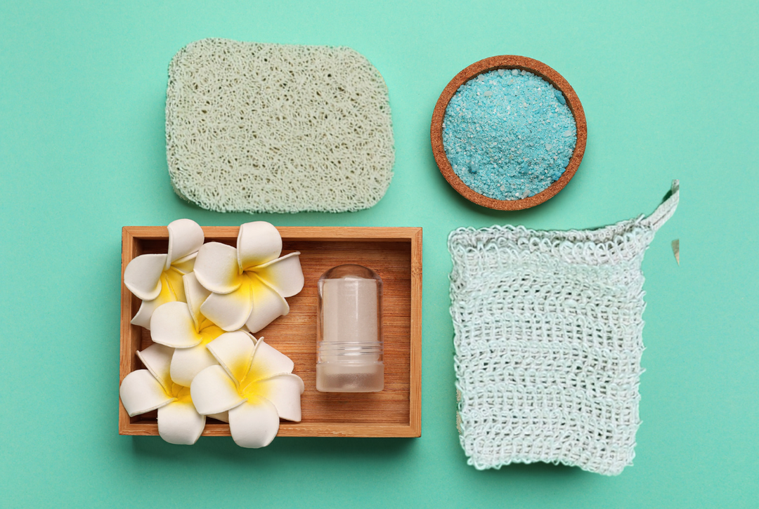 Handmade vegan soap set with natural loofah, exfoliating scrub, plumeria flowers, and soap saver pouch