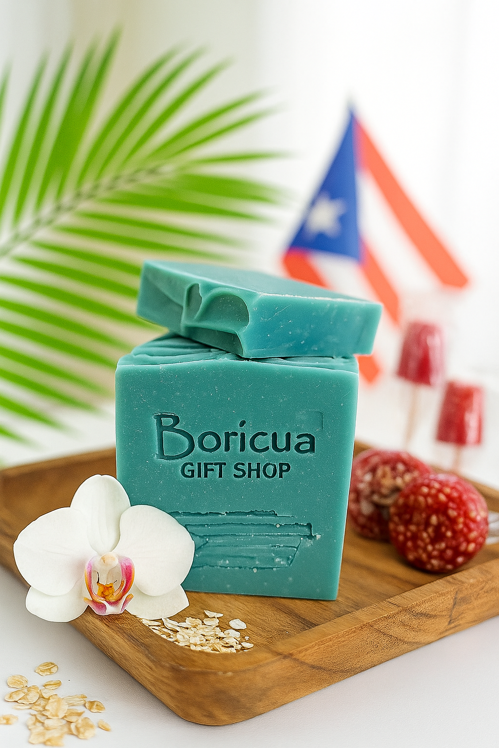 Boricua Gift Shop vegan soap with oatmeal in blue green color displayed with orchid and Puerto Rican flag