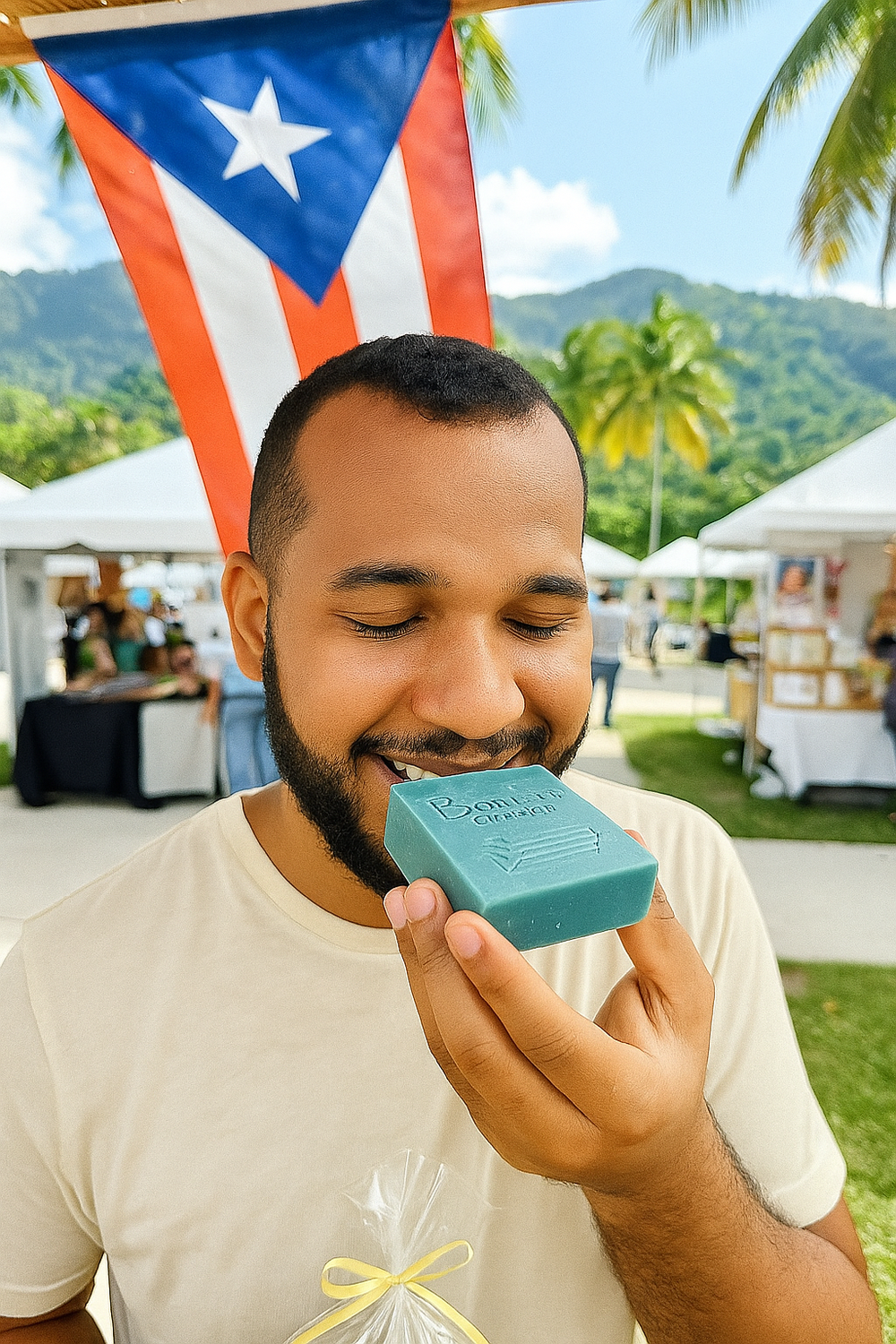 Man holding and smelling vegan soap with oatmeal from Boricua Gift Shop outdoors with Puerto Rican flag