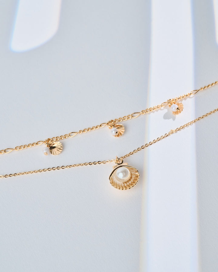 16K gold plated Del Mar necklace featuring a sea shell pendant with a pearl accent
