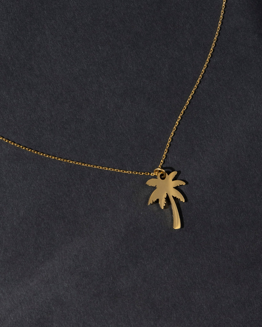 18K gold plated palm necklace on a delicate chain for a trendy coastal look