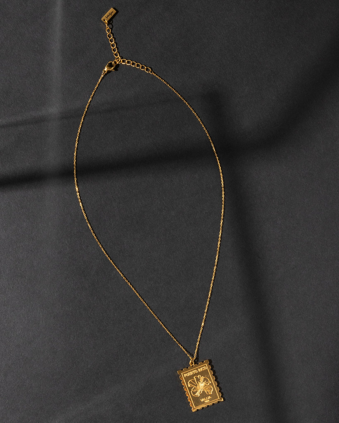 Valija 18K gold plated sello necklace with intricate floral design and adjustable chain