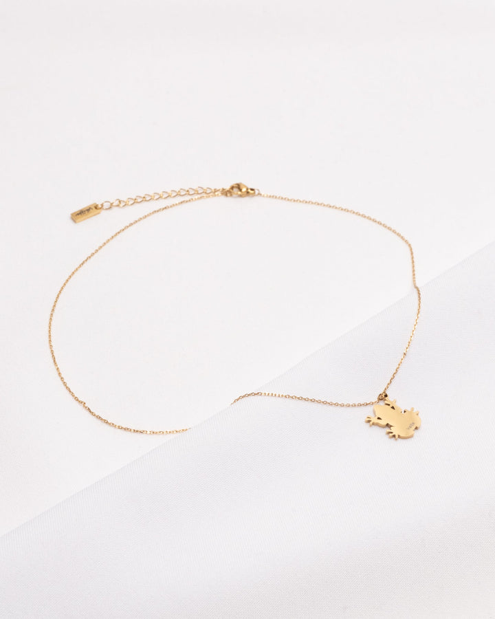 Elegant 18K plated Coquí necklace featuring a delicate charm and adjustable chain for a minimalist look