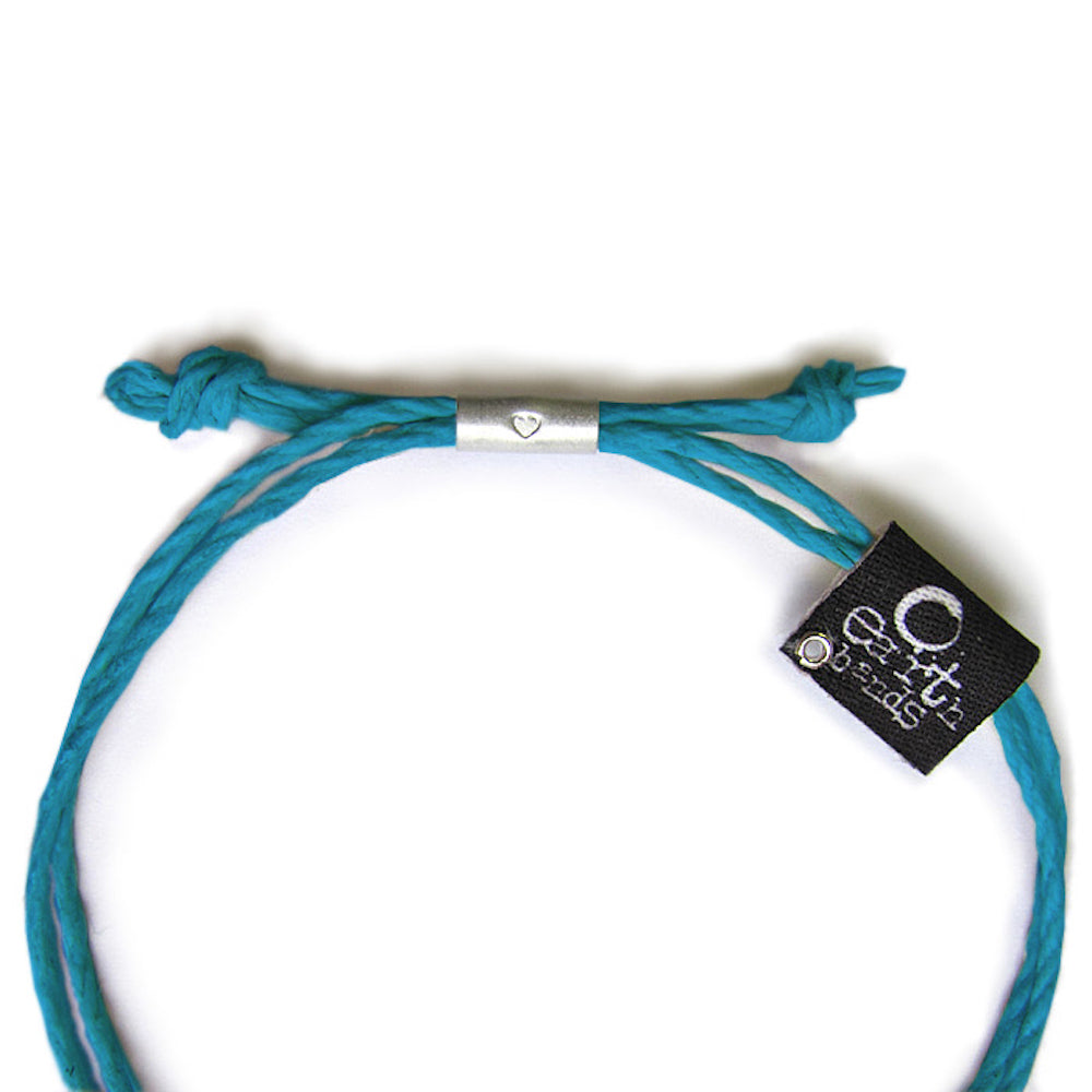 Earth Bands alien friendship bracelet handmade in turquoise with a silver heart charm