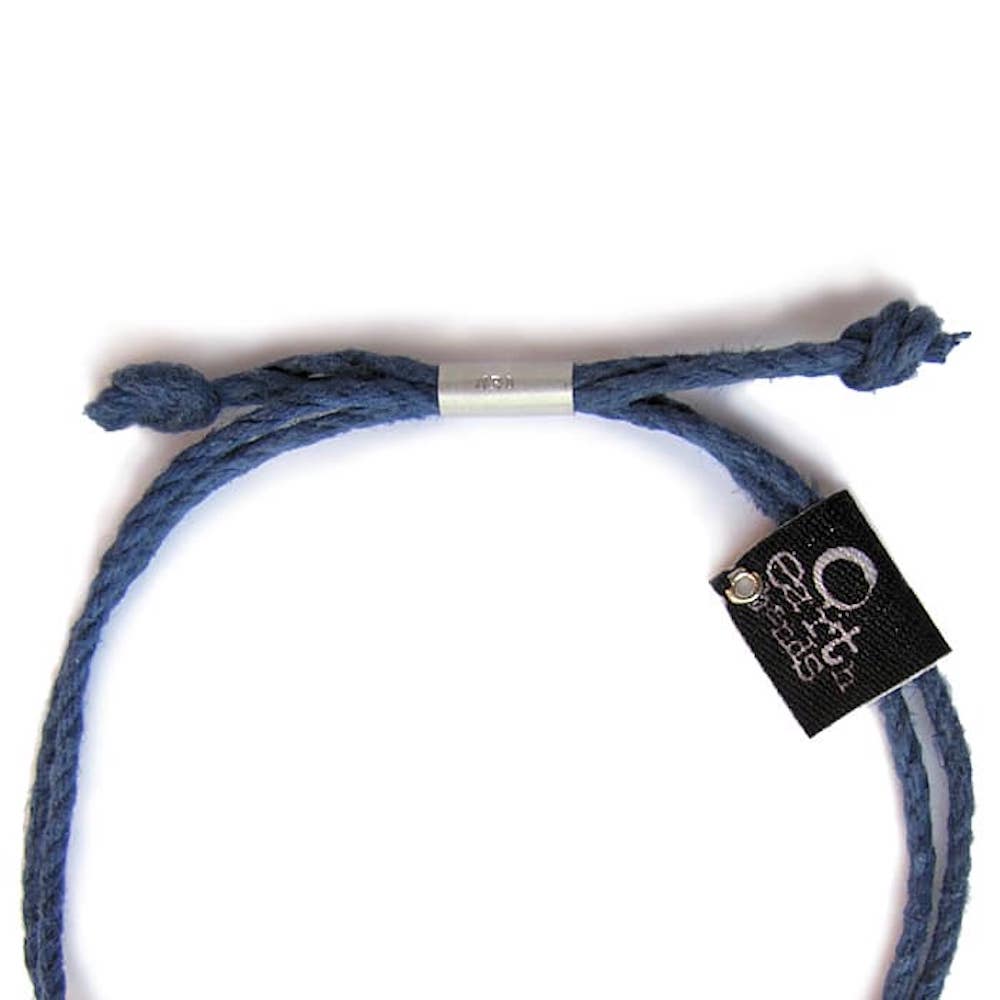 Earth Bands autism puzzle piece bracelet in blue with a minimalist design for autism awareness