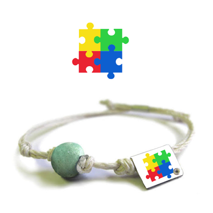Handcrafted autism puzzle piece bracelet with colorful charms and adjustable cord for stylish support