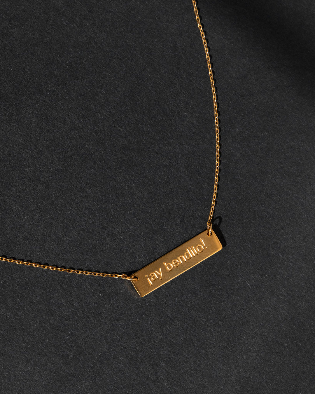 Ay Bendito necklace in gold with an elegant nameplate design on a delicate chain