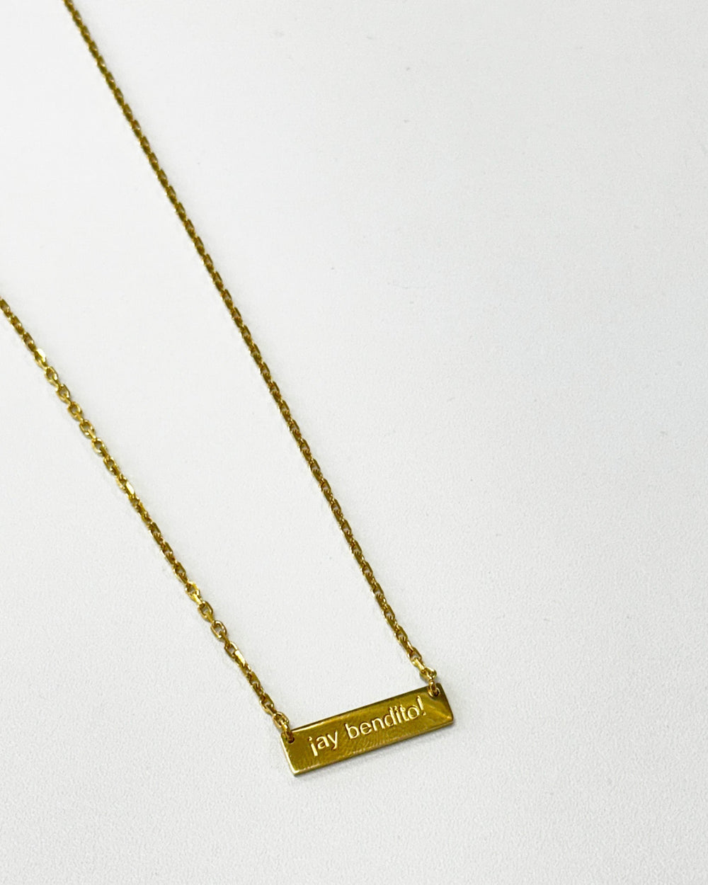 Gold Ay Bendito necklace featuring a minimalistic design and delicate chain.