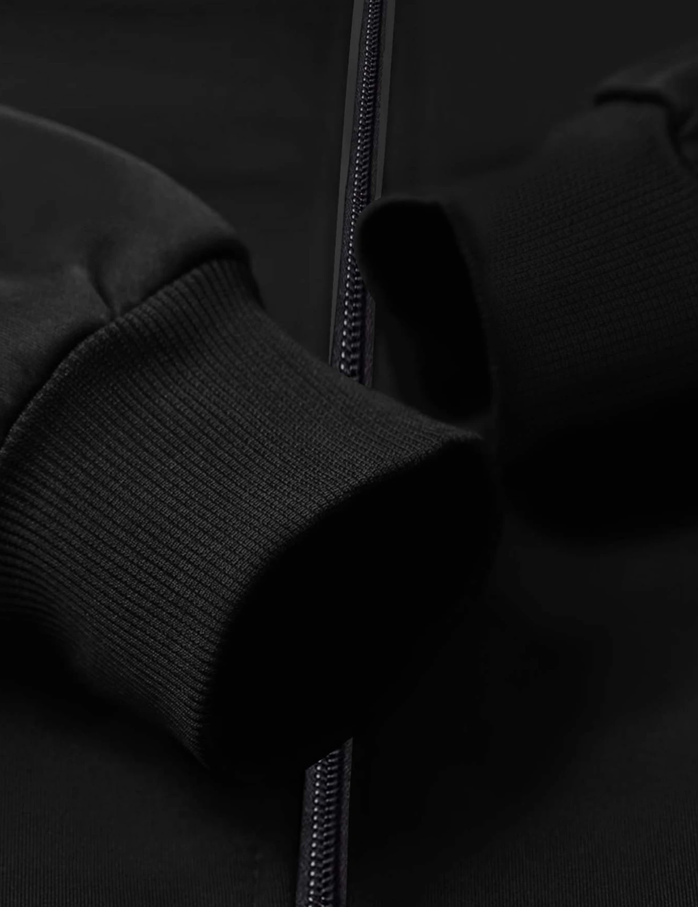 Close-up of black jacket Puerto Rico design featuring comfortable cuffs and a sleek zipper