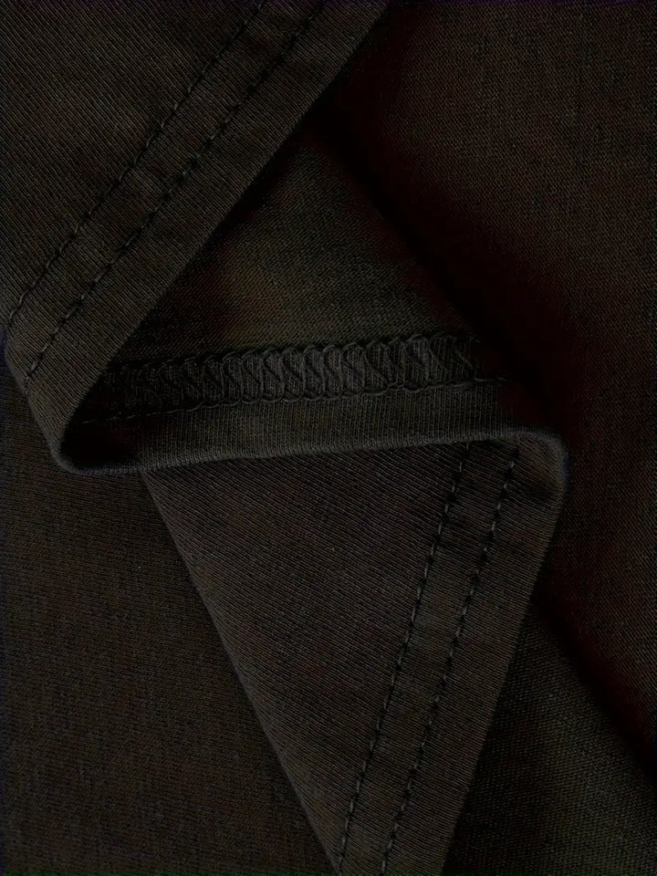 Close-up of black fabric stitching detail on Puerto Rican heritage t-shirt from Boricua Gift Shop