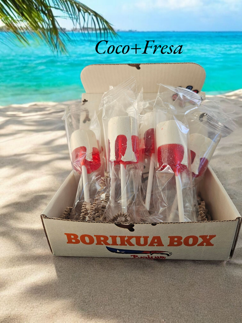 Boricua Gift Shop Coconut strawberry candy lollipops in a box with a tropical background