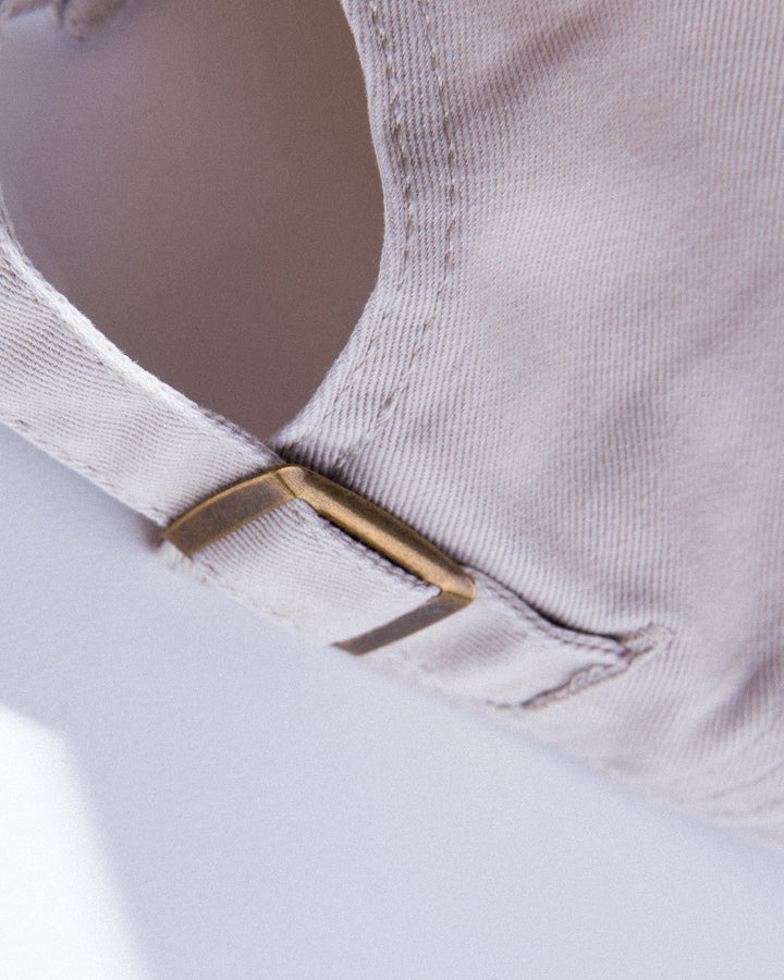 Close-up of Del Mar Y El Sol souvenir cap featuring an adjustable strap for a custom fit