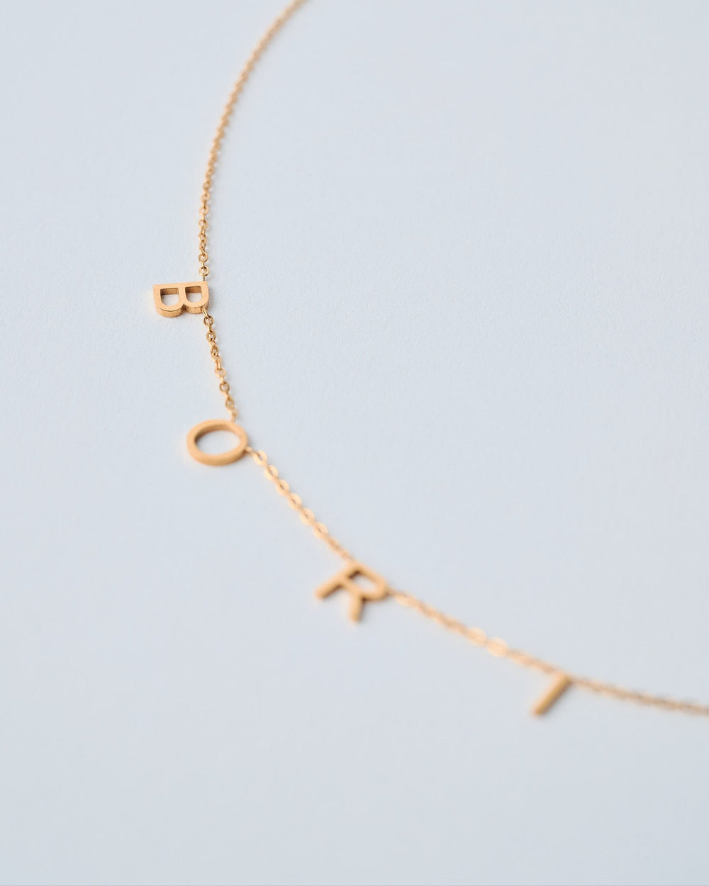Valija gold-plated necklace with lettered charms for personalized style