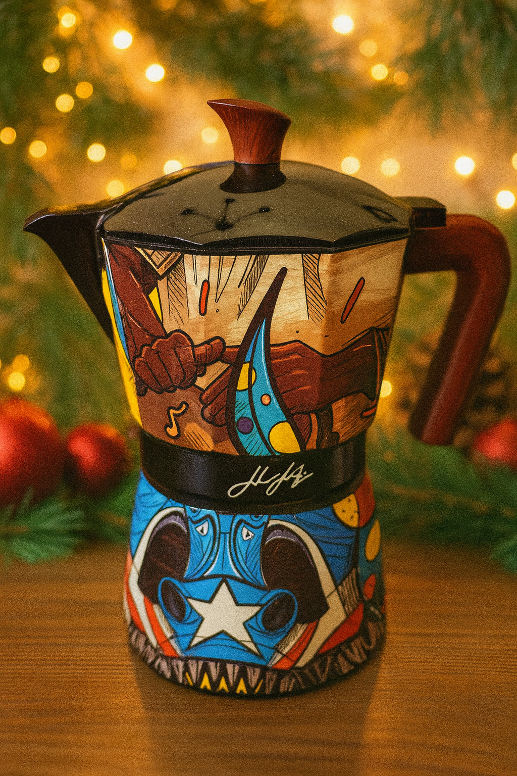 Colorful hand-painted greca coffee pot featuring artistic designs and a stylish wooden handle