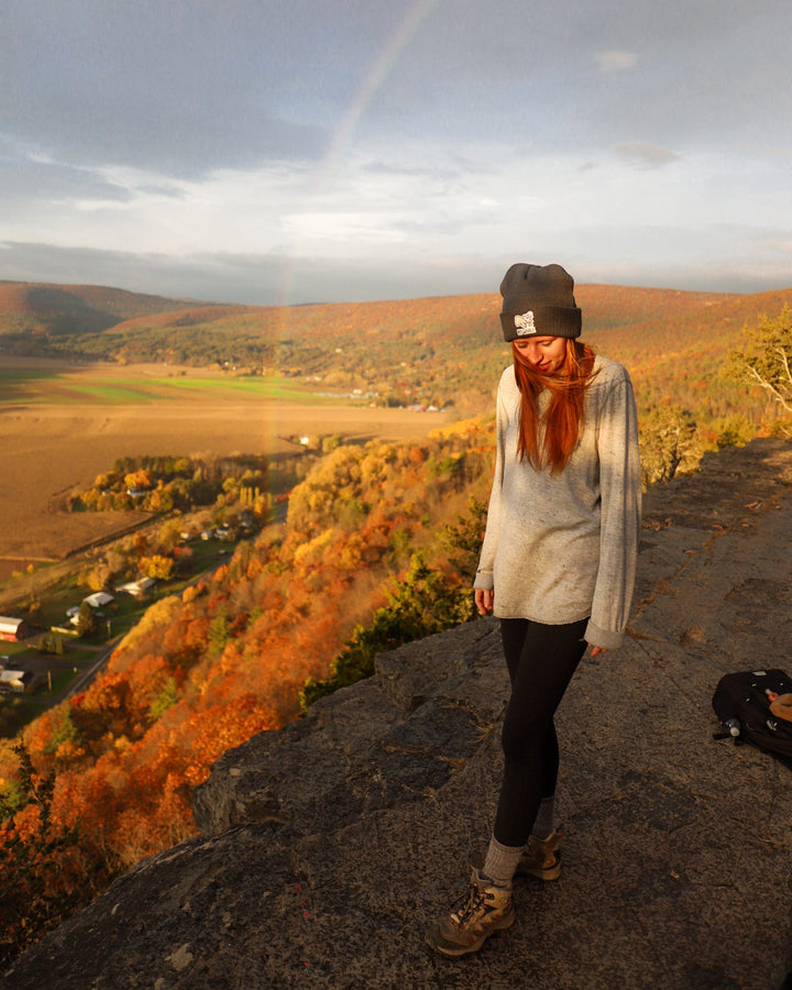 Earth Bands handmade Christmas Santa gift jewelry worn by model outdoors with a scenic background