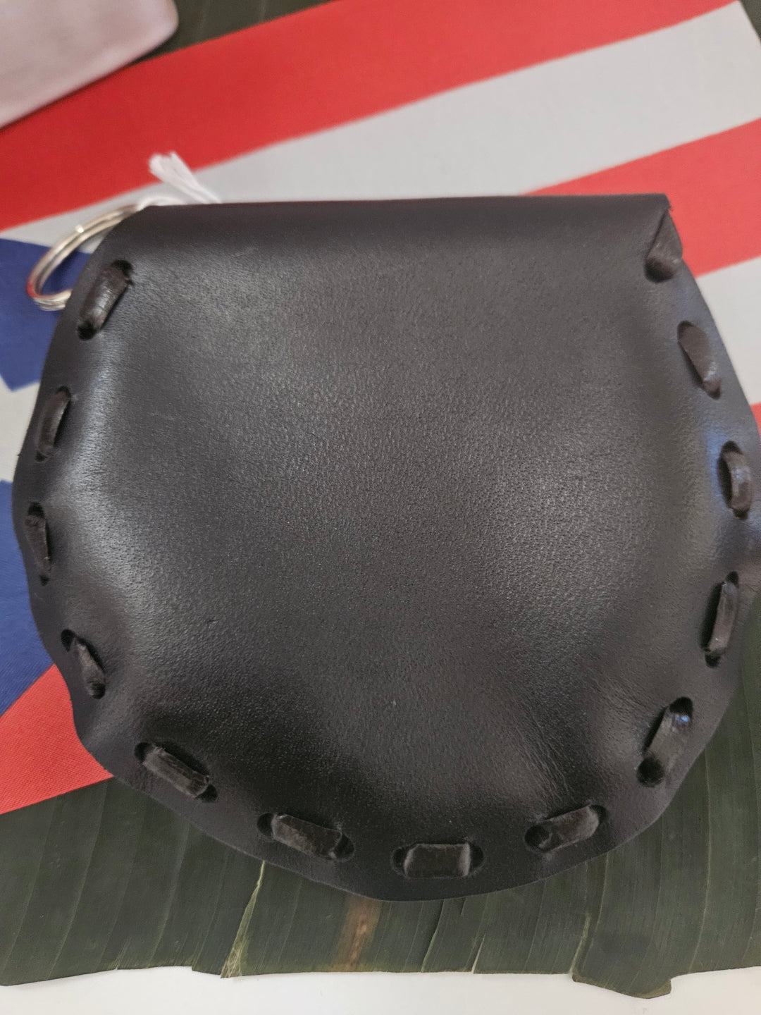 Handmade leather pouch Puerto Rican with unique stitching design in classic black color