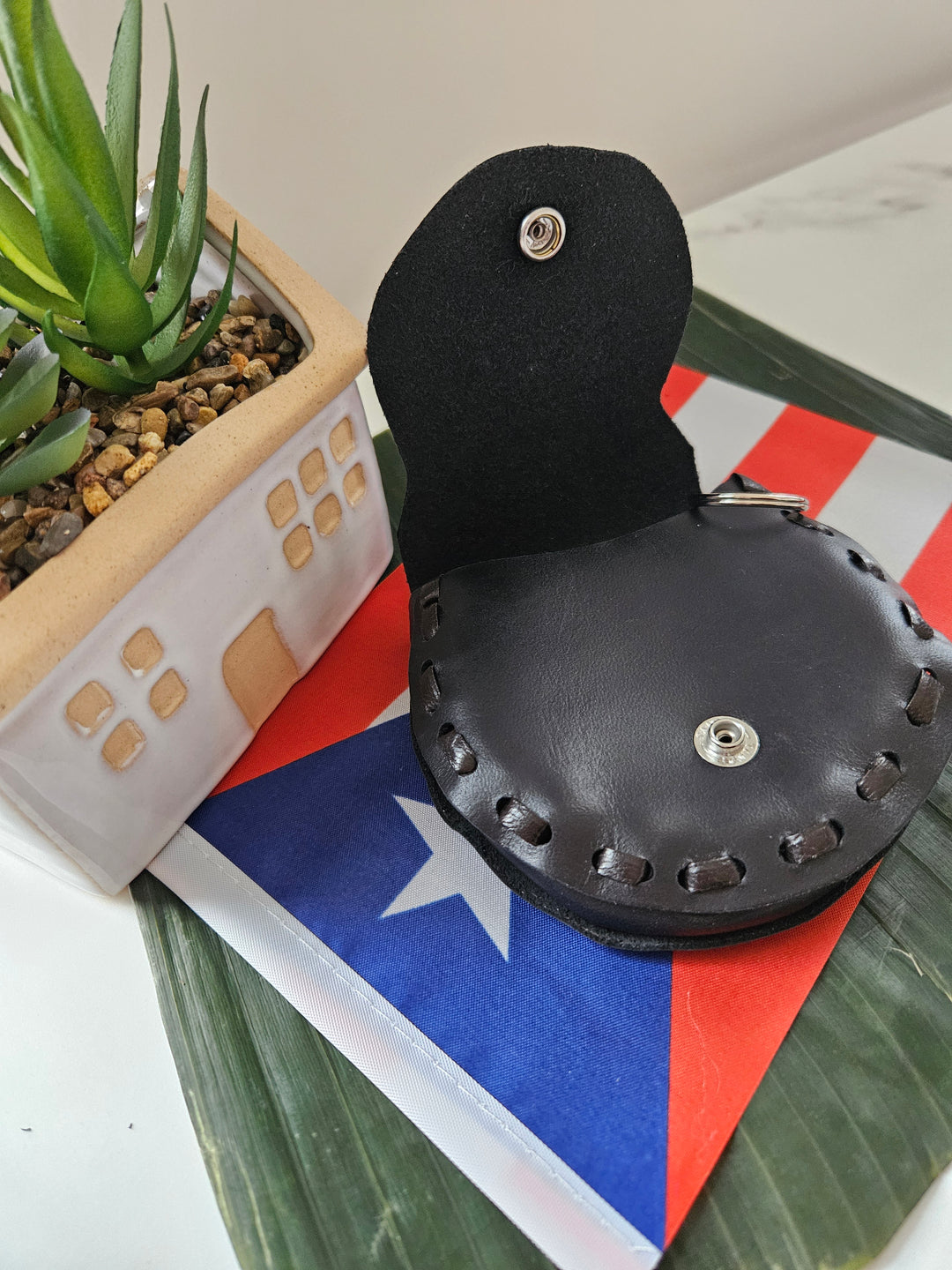 Handmade leather pouch Puerto Rican with detailed stitching, perfect for accessories or small items