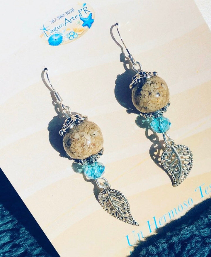 Lagunarte sand and crystal earrings with beige sand beads, blue crystals, and silver leaf charms