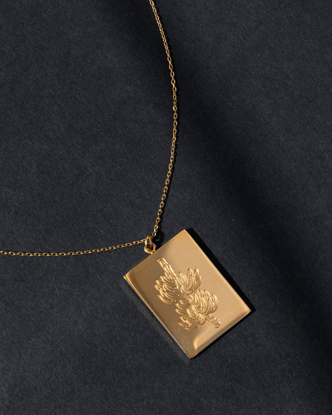 Elegant Valija 18K plated racimo necklace featuring a floral design on a rectangular pendant