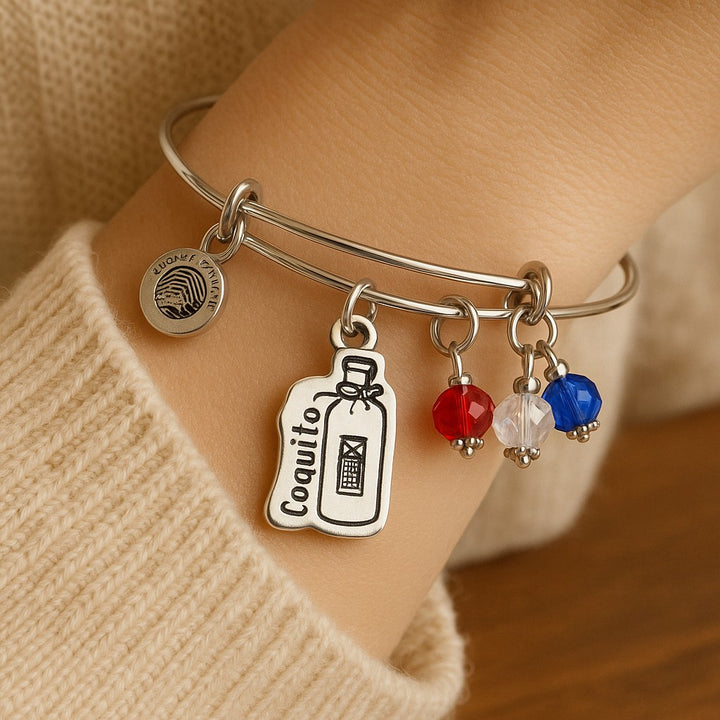 Chubby Chico Puerto Rican Coquito Bracelet with decorative charms in red, white, and blue