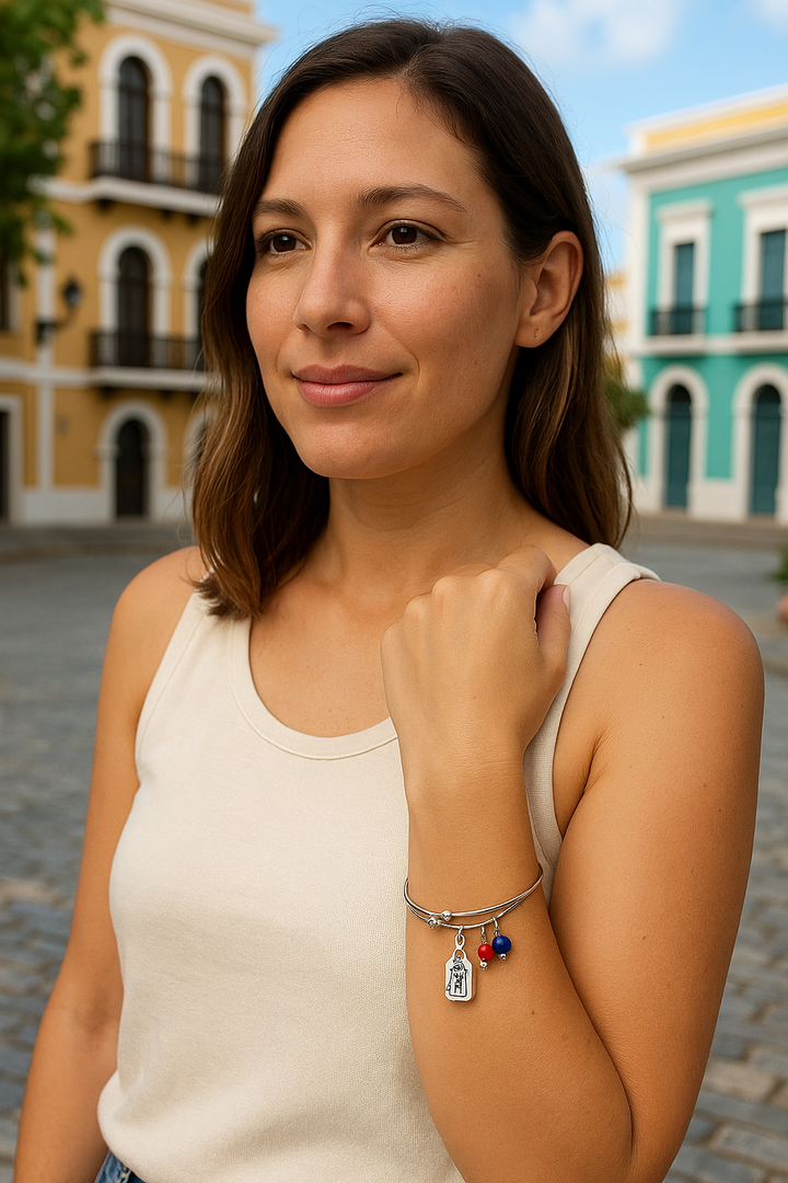 Chubby Chico Puerto Rican Coquito Bracelet worn by a woman in a historic street setting