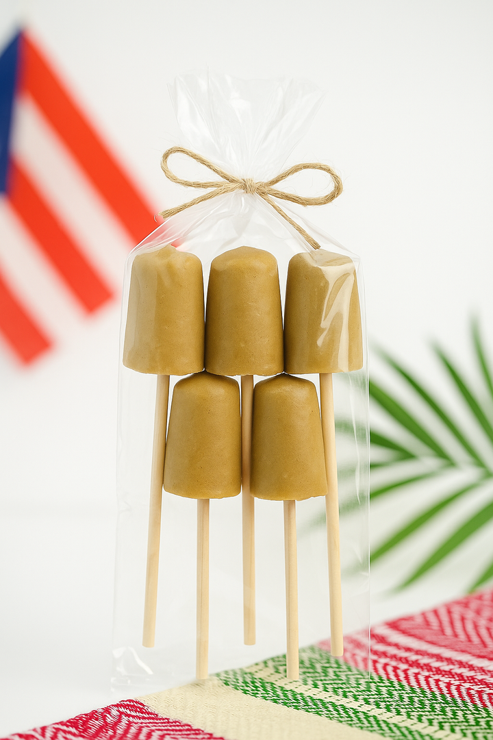 El Artesano Puerto Rican coquito lollipop set wrapped in clear plastic with Puerto Rican flag in background