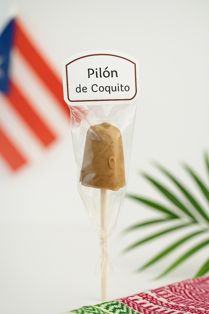 El Artesano Puerto Rican coquito lollipop in clear wrapper with label and Puerto Rican flag background
