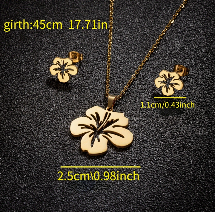 Elegant Puerto Rican floral jewelry set with a gold floral necklace and matching earrings