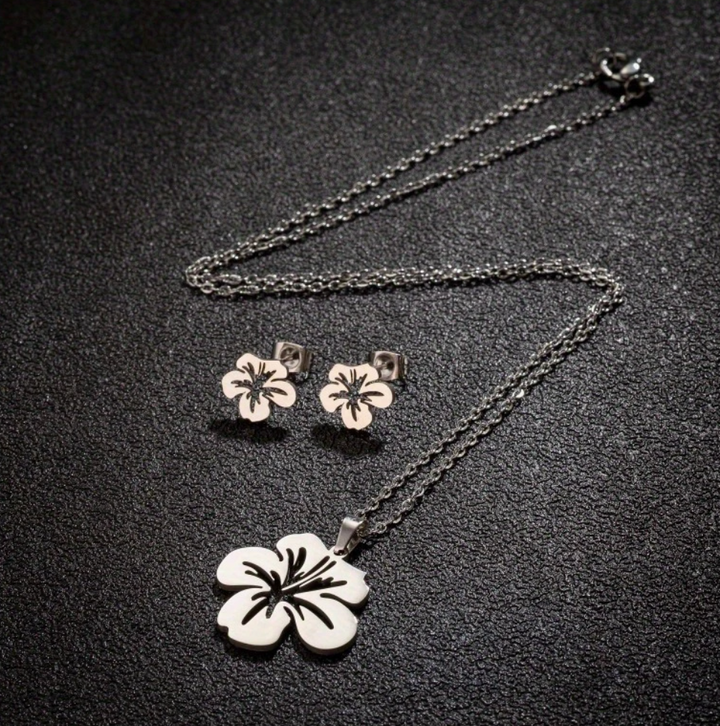 Elegant Puerto Rican floral jewelry set with pendant necklace and matching earrings in floral design