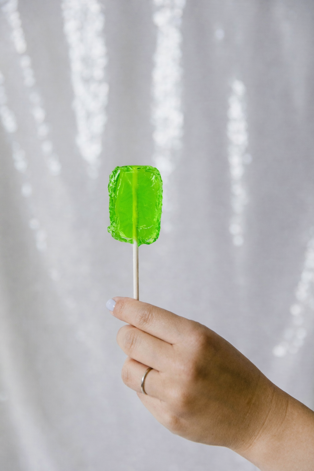 Puerto Rican lemon candy on a stick, bright green color, from Boricua Gift Shop