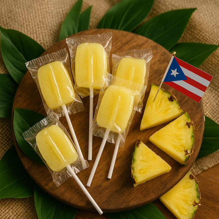 Puerto Rican pineapple lollipop displayed on a wooden platter with fresh pineapple slices