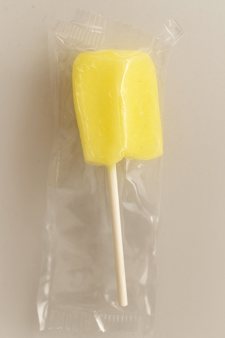 Tipica Artesanal Puerto Rican pineapple lollipop in yellow color with a stick for easy enjoyment
