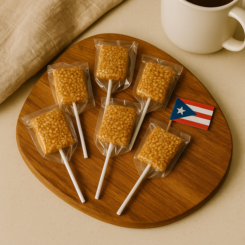 Puerto Rican sesame lollipop individually wrapped on a wooden platter with a coffee mug and flag