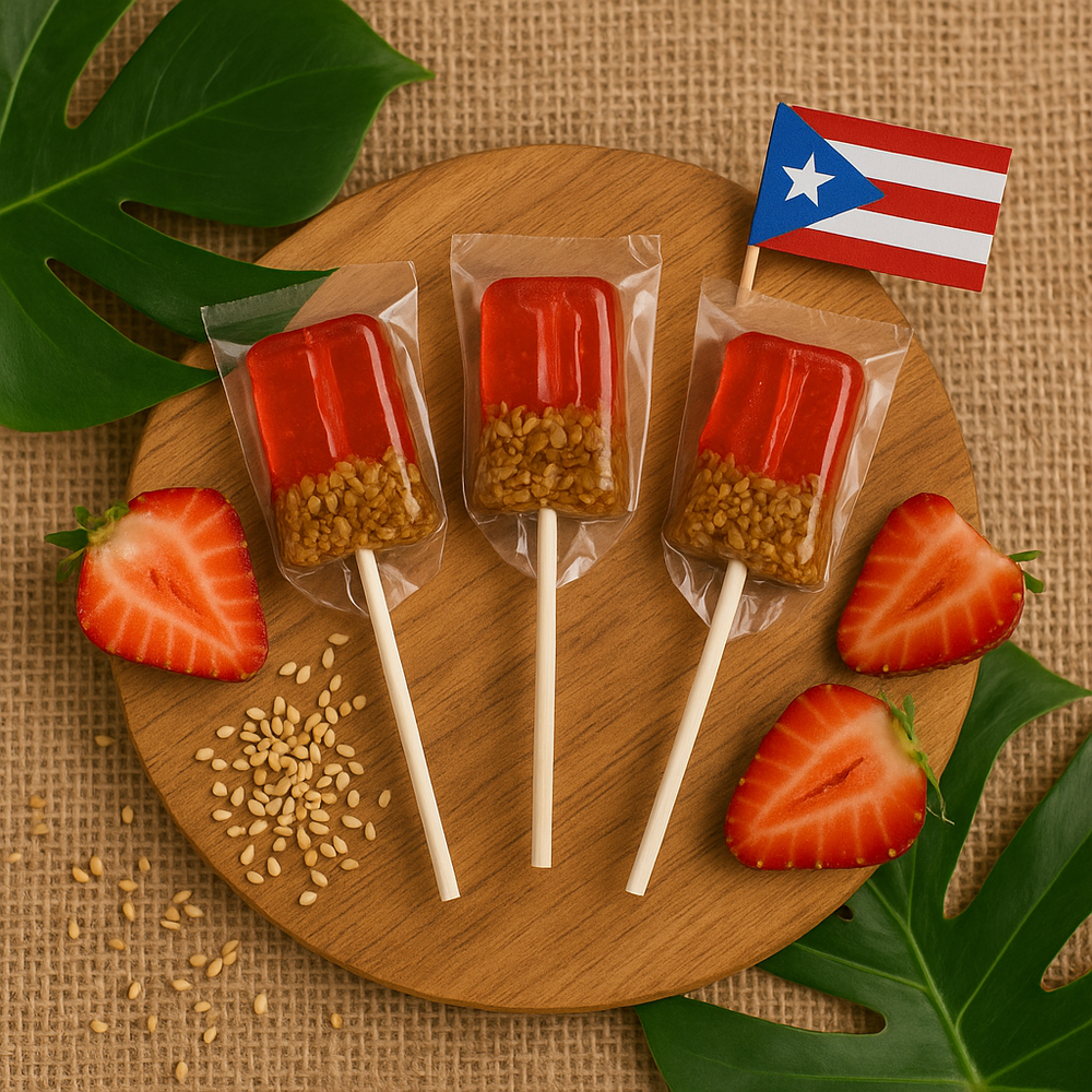 Tipica Artesanal Puerto Rican strawberry lollipop with sesame base and fresh strawberries on a wooden platter