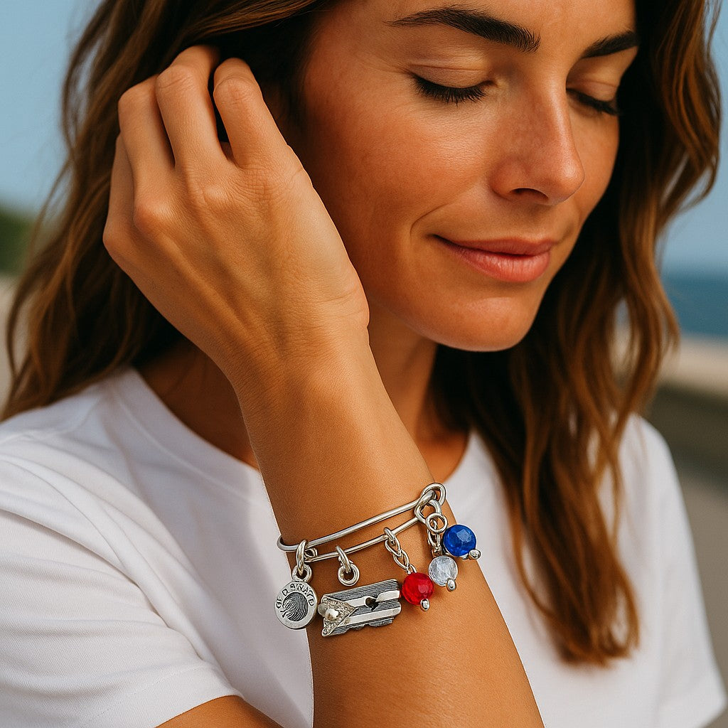  Puerto Rico charm bracelet with colorful beads and silver charms on a woman's wrist