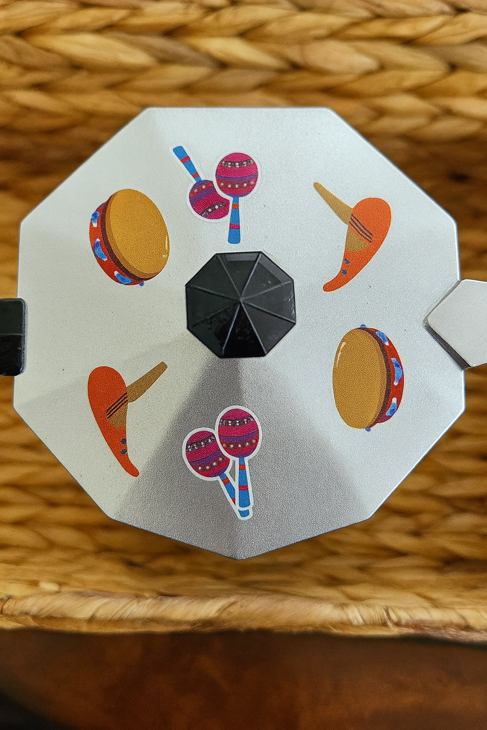 Colorful Puerto Rico coffee maker with festive percussion instrument designs on the lid