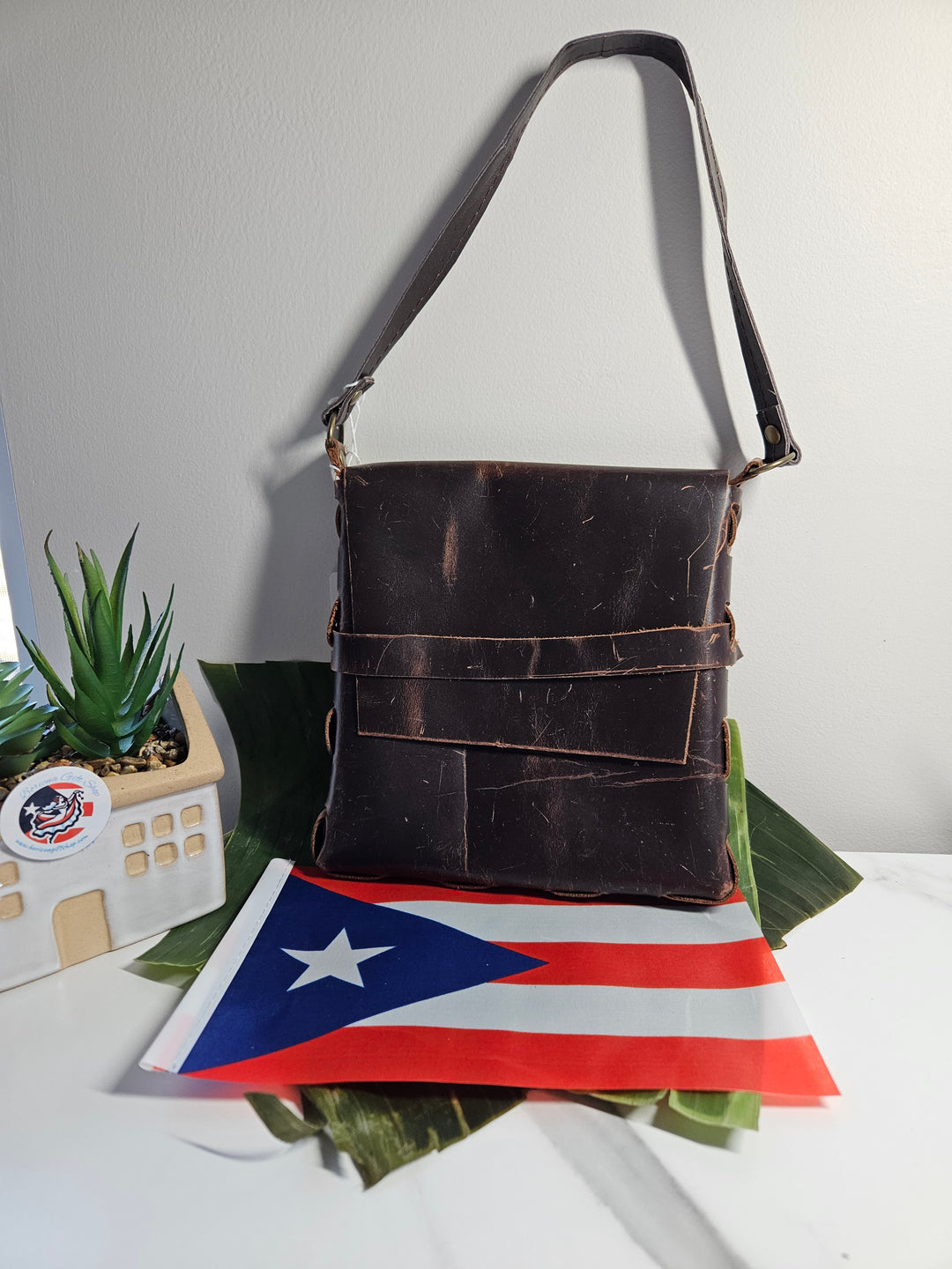 Handcrafted rustic brown leather handbag by Atelierry featuring multiple pockets and a stylish design