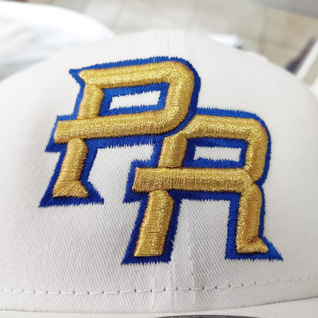 Peligro Sports snapback hat with embroidered PR in white and gold