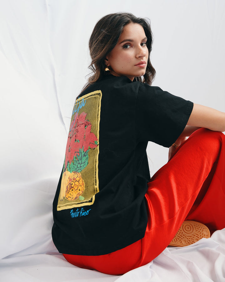 Valija abuelita graphic top in black featuring floral design on the back for a stylish look