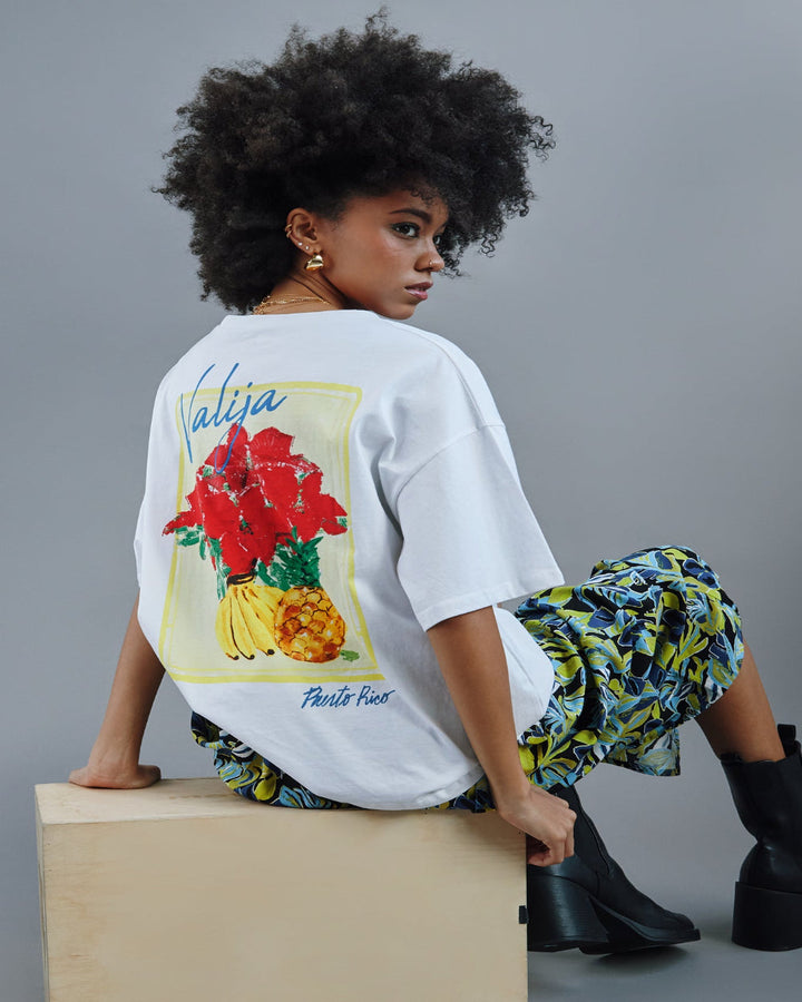 Valija abuelita graphic top featuring vibrant floral and fruit design on a white background