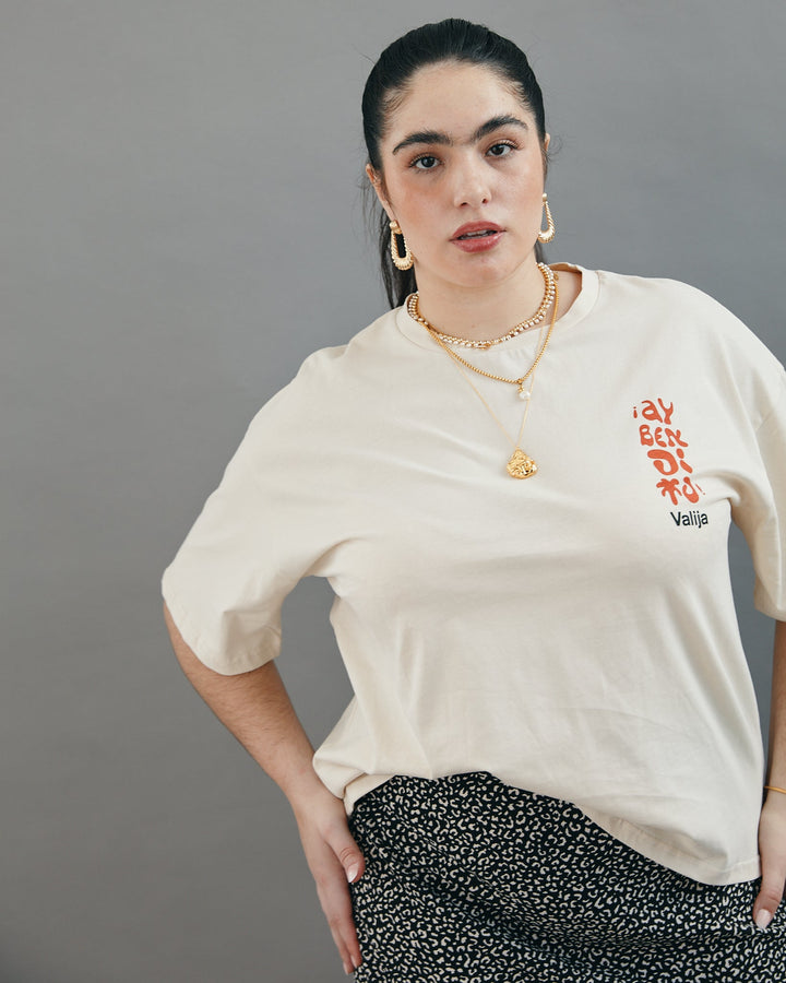 Valija Ay Bendito graphic T-shirt in warm cream color, featuring a stylish design and relaxed fit