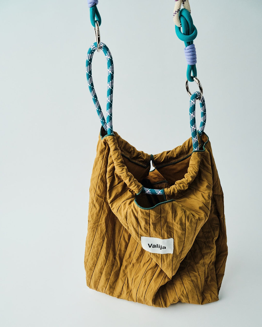 Stylish convertible Valija tote bag in mustard color with unique straps for versatile use