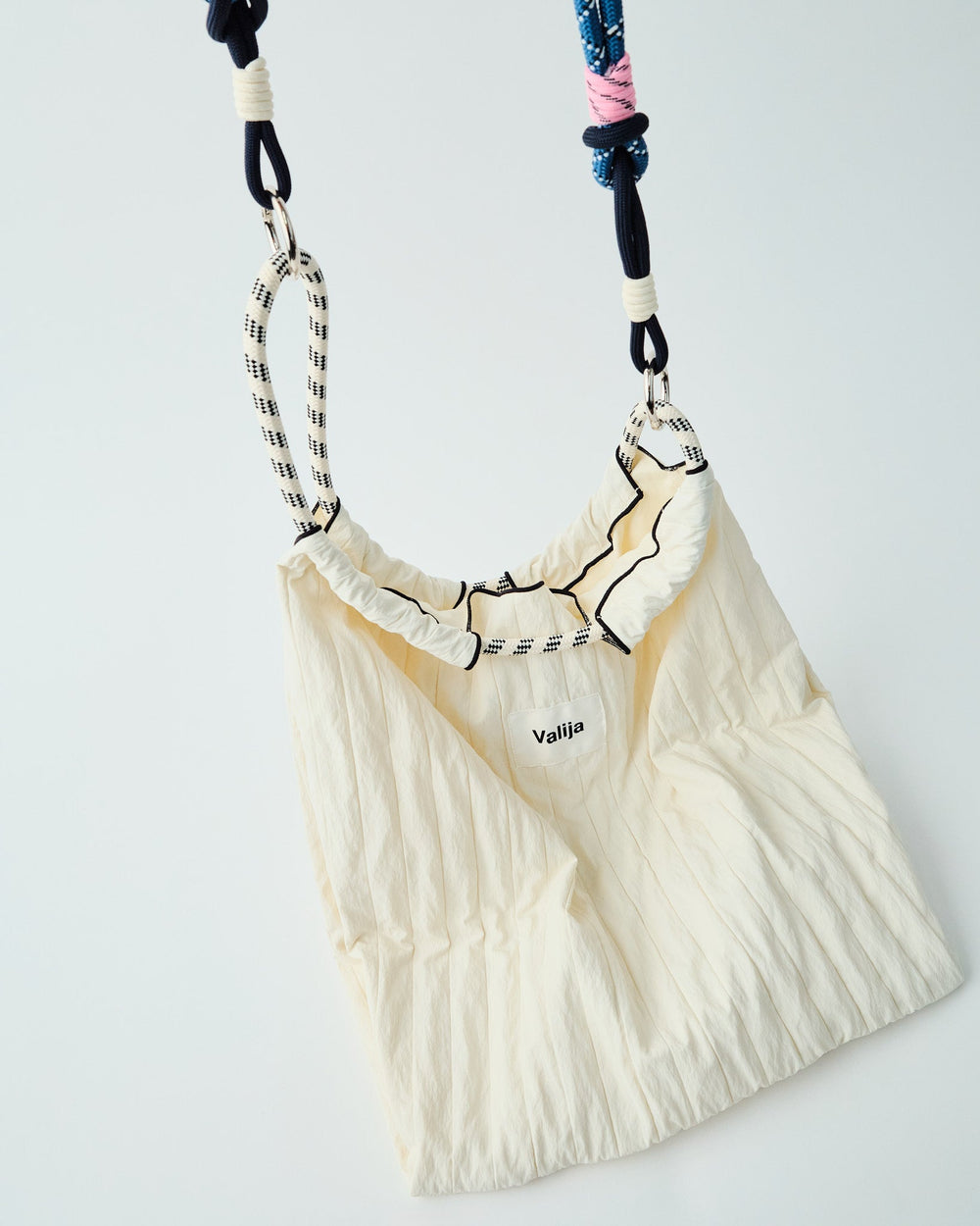 Convertible Valija tote bag in cream with unique strap design for versatile styling