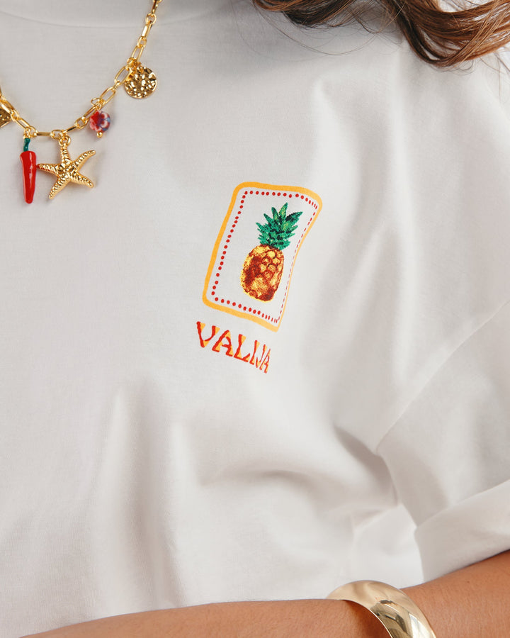 Valija Parranda graphic t-shirt featuring a colorful pineapple design on a white background