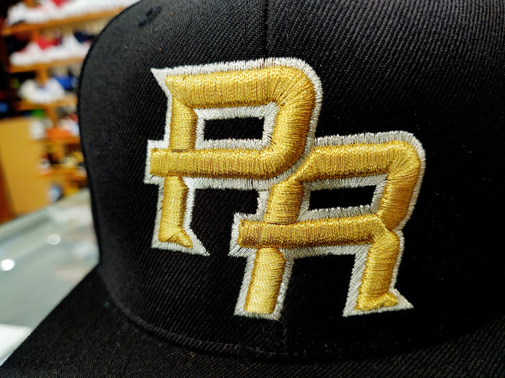 Black snapback hat with PR emblem for Puerto Rico pride
