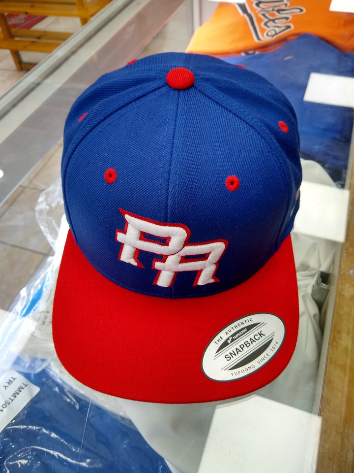 Peligro Sports snapback hat in blue and red for Puerto Rico fans