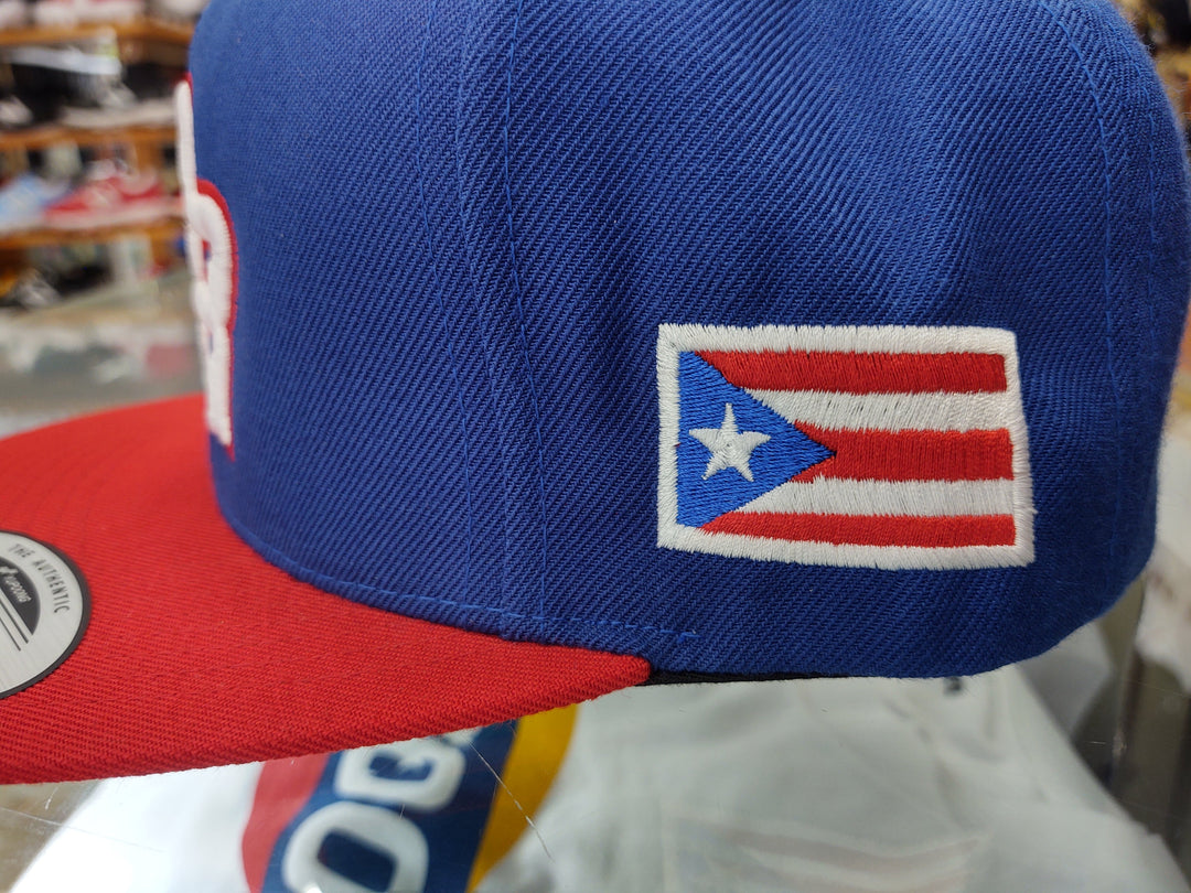 Peligro Sports snapback hat in blue and red with Puerto Rico flag patch