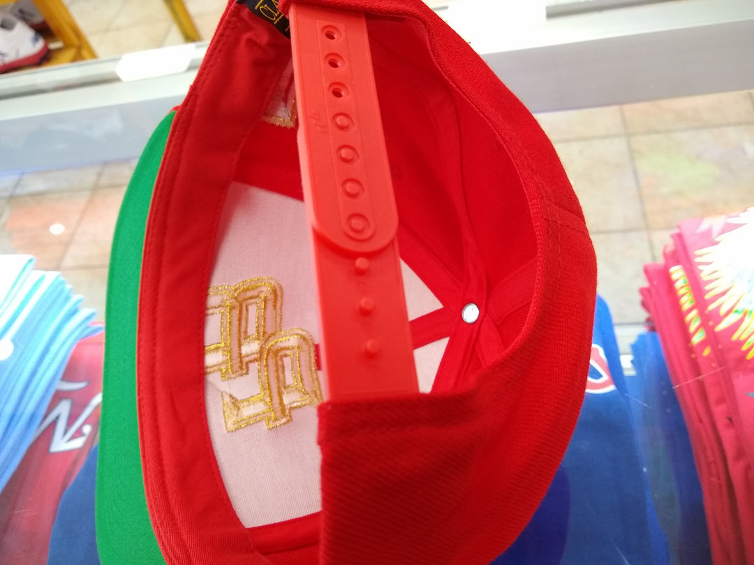 Peligro Sports red snapback hat with adjustable strap and embroidered logo